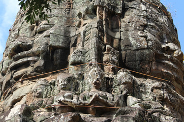 Fototapeta na wymiar Buddha looks at 4 sides of the world. Angor Wat, Cambodia