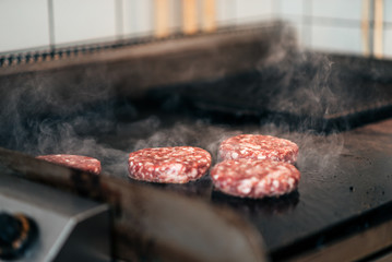 Close-up image of preparation of burger patties.