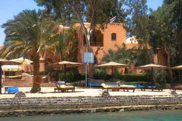 Beautiful view of the coastline with houses and hotels on the red sea. Tourist region in Egypt. Hurghada and its traditions. Stock photo for design