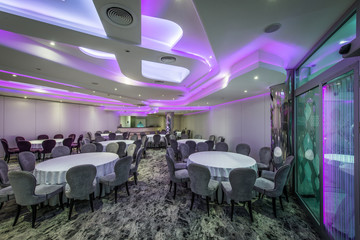 Layered lights on ceiling in banquet hall