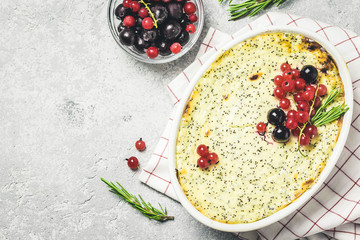 Fototapeta na wymiar Cottage cheese poppy seed and berries casserole. Top view, space for text.