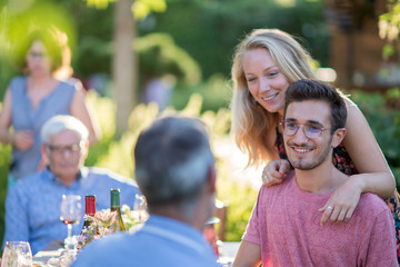 Family picnic. Focus on a handsome young man 