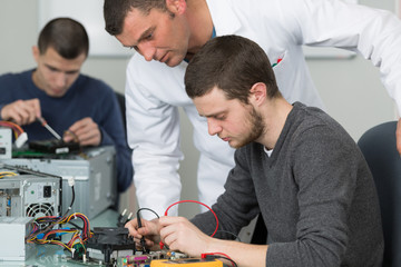 teacher training students on electronic components