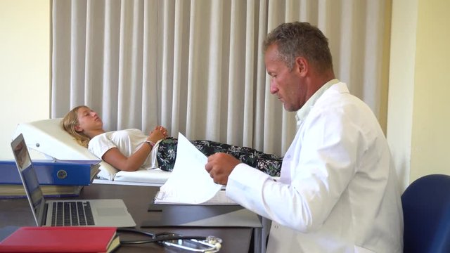 Doctor Consults With Patient