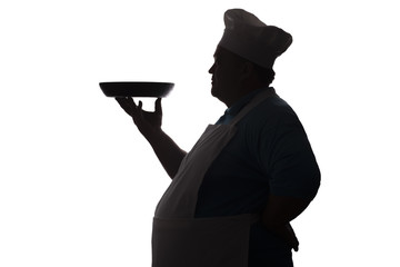 silhouette of a chief-cooker profile on a white isolated background, man carrying the dish to serve