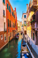 Fototapeta na wymiar Picturesque buildings and gondolas on one of the canals in Venice, Italy.