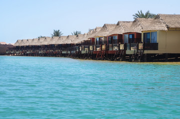 Beautiful view of the coastline with houses and hotels on the red sea. Tourist region in Egypt. Hurghada and its traditions. Stock photo for design