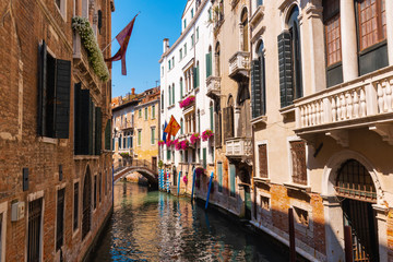 Picturesque buildings on a deserted canal in Venice, Italy.