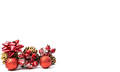 Red Christmas decoration, pine cone , frozen rose hips, red balls isolated on white background, space for text.