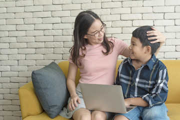 mother and her son used tablets for learning read e-book