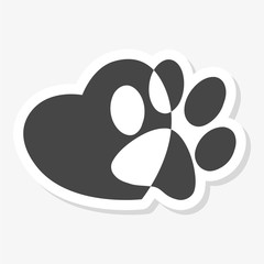 Silhouette of a paw print with a heart symbol sticker © sljubisa