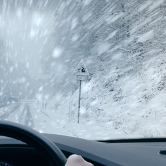 Winter Driving - Heavy snowfall on a country road. 