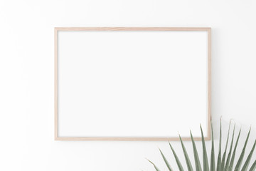 Landscape large 50x70, 20x28, a3,a4, Wooden frame mockup on white wall. Palm leaves. Poster mockup....