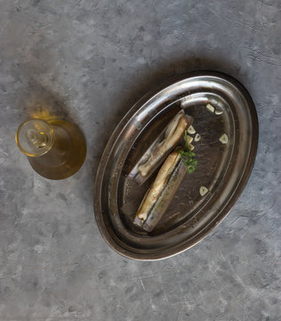 Plate with garlic and razor clams