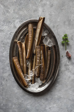 Plate with ice and razor clams