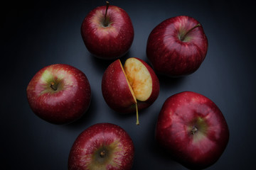 tasty juicy apples on a dark background