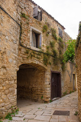 Fototapeta na wymiar A street in the historic village of Vodnjan (also called Dignano) in Istria, Croatia 