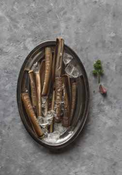 Plate with ice and razor clams