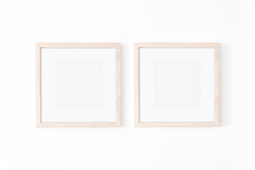 Set of 2 square Wooden frame mockup with passe-partout on white wall. Poster mockup. Clean, modern, minimal frame. Empty fra.me Indoor interior, show text or product