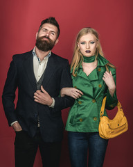 Romantic couple. Autumn fashion trends. Love relations. Couple in love in fashionable style. Fashion couple of sexy woman and bearded man. Enjoying friendly relations. Autumn street style