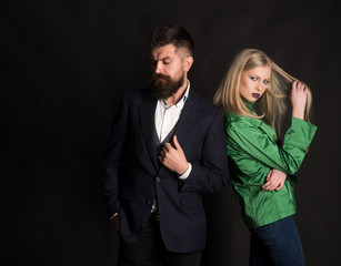 A sense of style. Couple in love in fashionable style. Fashion couple of sexy woman and bearded man. Love relations. Autumn fashion trends. Enjoying friendly relations. Autumn street style