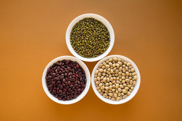 Different types of beans in bowls. Mung bean, red beans, yellow beans