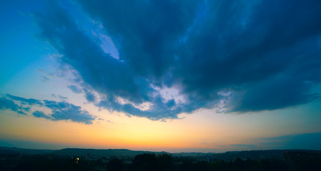 Beautiful sunset sky above clouds with dramatic light.