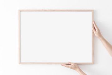 Landscape large 50x70, 20x28, a3,a4, Wooden frame mockup on white wall. Poster mockup. Clean, modern, minimal frame. Empty fra.me Indoor interior, show text or product