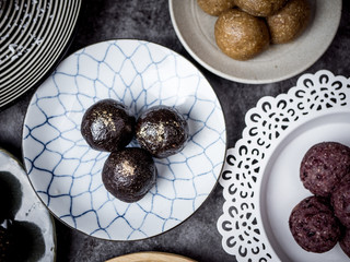 Fototapeta na wymiar Healthy organic date energy balls with dried fruits and nuts. Food for healthy lifestyle.