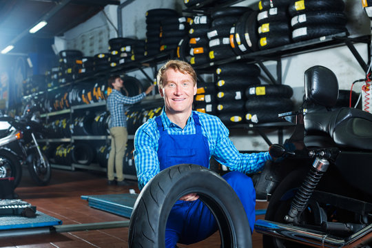 Man working with bike tires