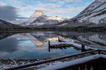 Warm dawn light on Mtt Henkel and the canoe dock after a snow storm. Glacier National Park, Montana
