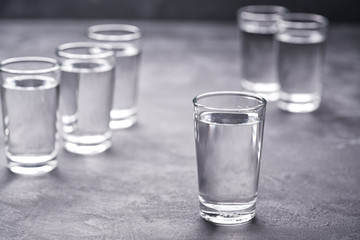 Russian vodka shots on black table, copy space