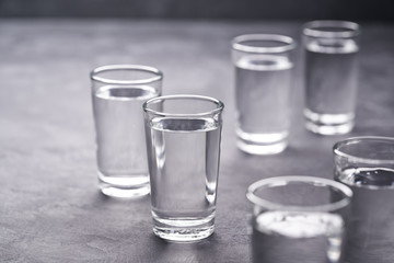 Russian vodka shots on black table, copy space
