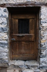 Fototapeta na wymiar Rustic doorway of old dwelling in Cabbio, village in Ticino (Italian Switzerland)