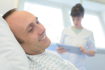 Fototapeta premium happy patient lying on hospital bed