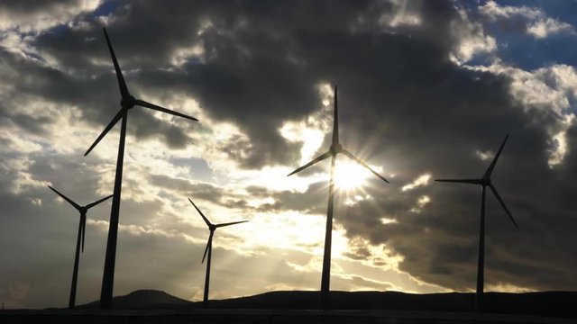 Wind generators in arinaga on sunset.