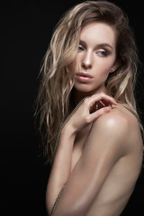 Naklejka premium Young beautiful blonde with silver necklace