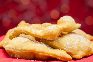Traditional Colombian christmas dish called hojaldras on red background