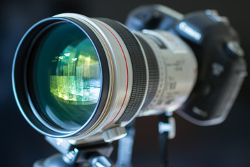 Fototapeta na wymiar Luxury telephoto lens attached to digital camera.
