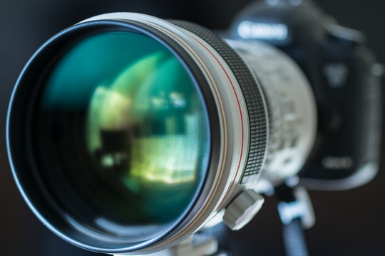 Luxury telephoto lens attached to digital camera.