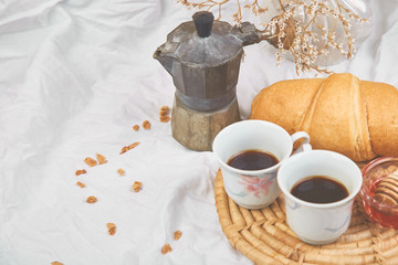 Good morning. Two cup of coffee with croissant and jam.