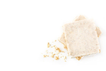 Typical christmas almond nougat isolated on white background. Top view. Copyspace