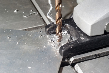 drilling process on small drill press close-up