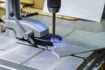 drilling process on small drill press close-up