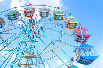 Ferris wheel on the background of blue sky,Colourful Vintage Ferris wheel