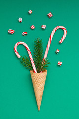 Christmas card with candy canes in waffle cone