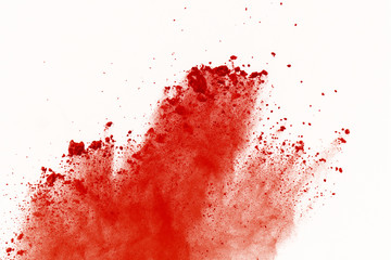 Red powder explosion on white background. Paint Holi.