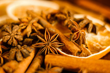 Christmas background: spices - anise stars, cinnamon sticks, selective focus