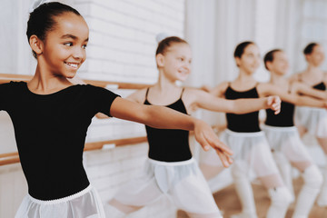 Ballet Training of Group of Young Girls Indoors. - Powered by Adobe