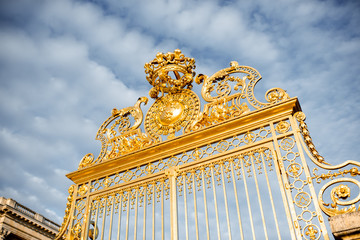 Close-up view of the golden gate of the palace of Versailles in France